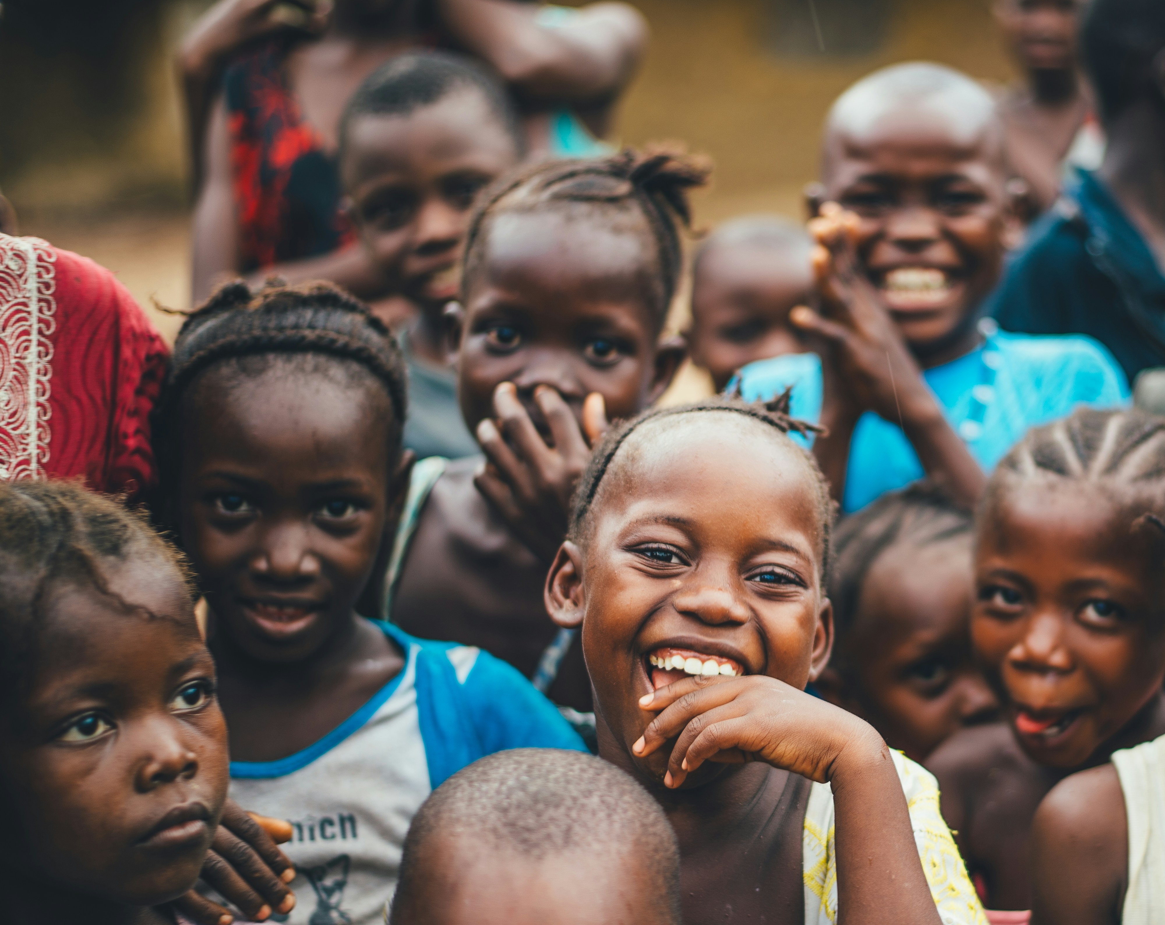 Children smiling during a community outreach program