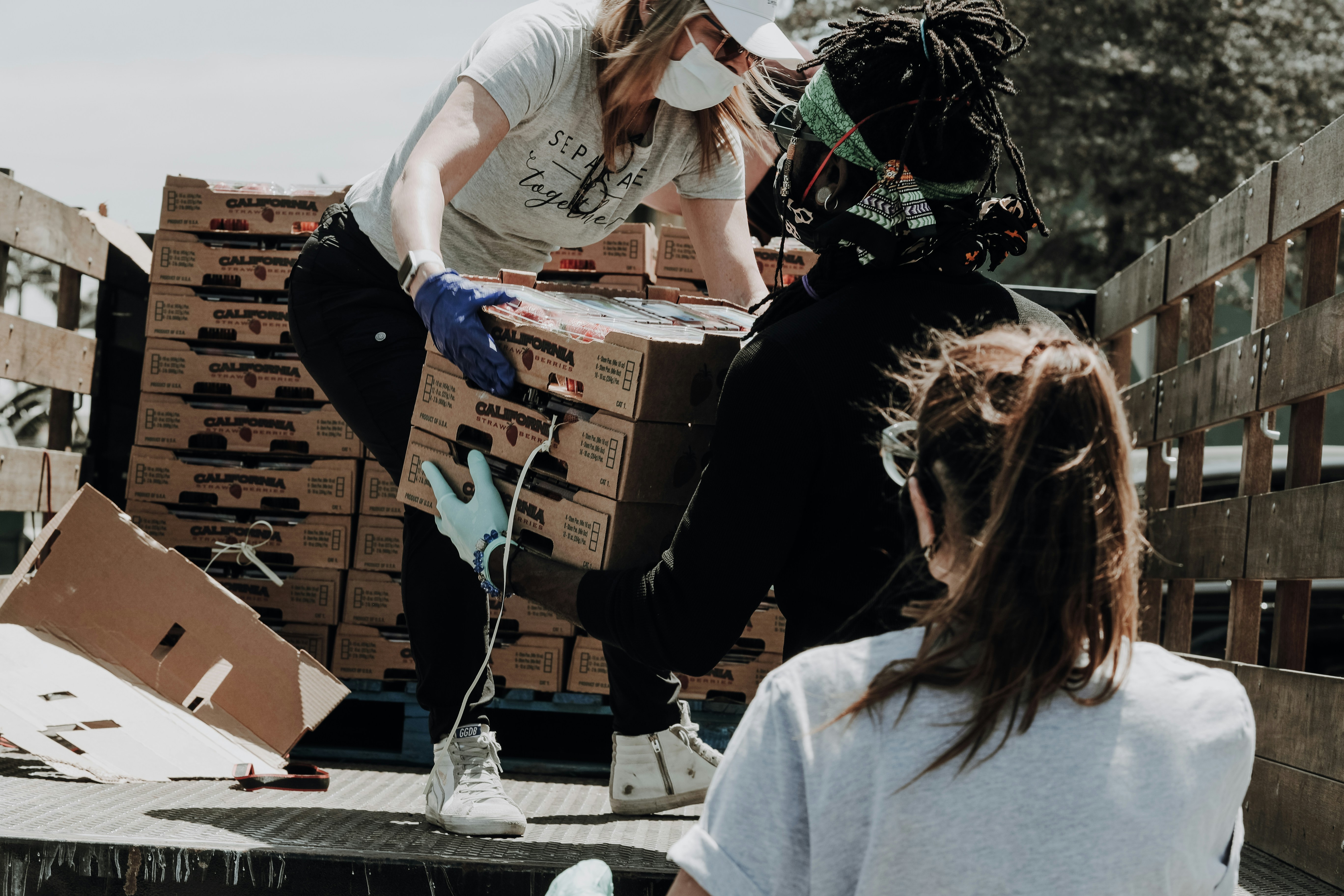 Volunteers distributing supplies to families in need