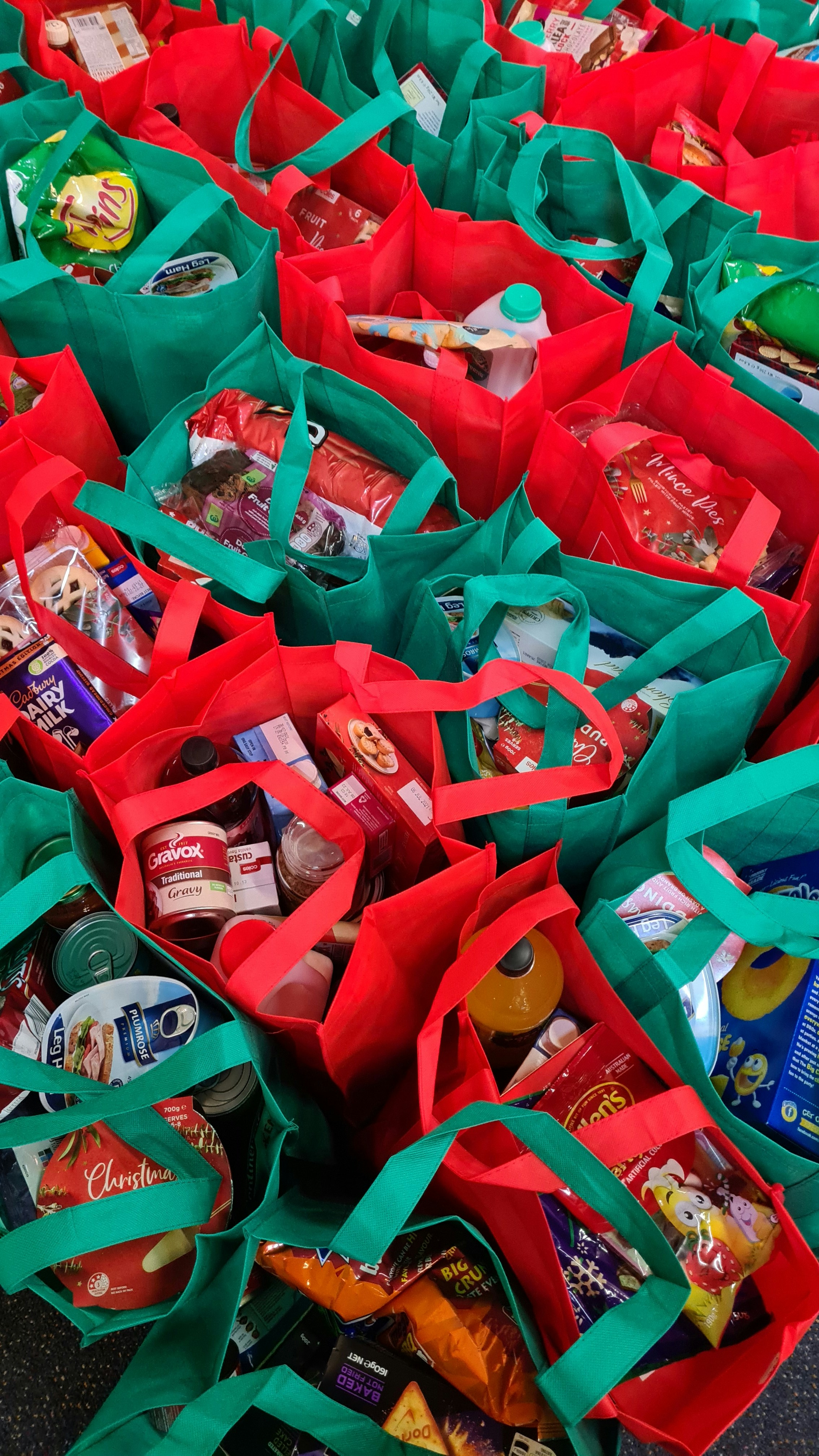 Volunteers preparing holiday care packages for families